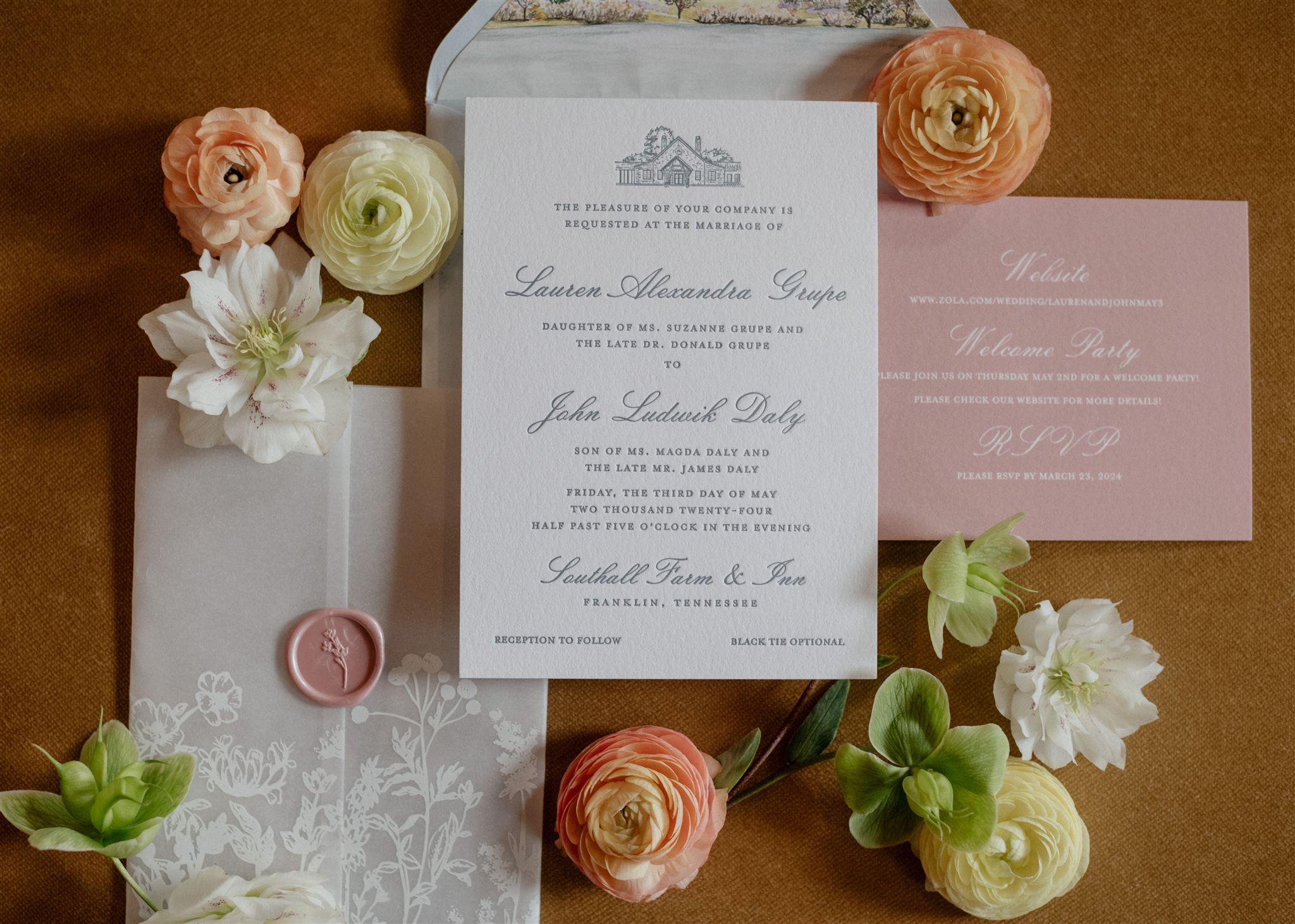 Flat lay of formal wedding invitation suite decorated with flowers.