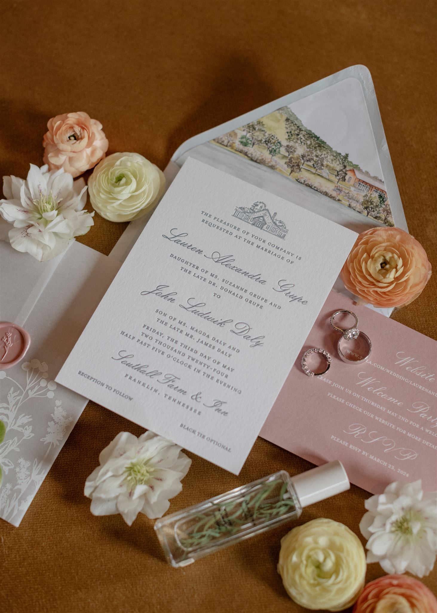 Flat lay of formal wedding invitation suite decorated with flowers.