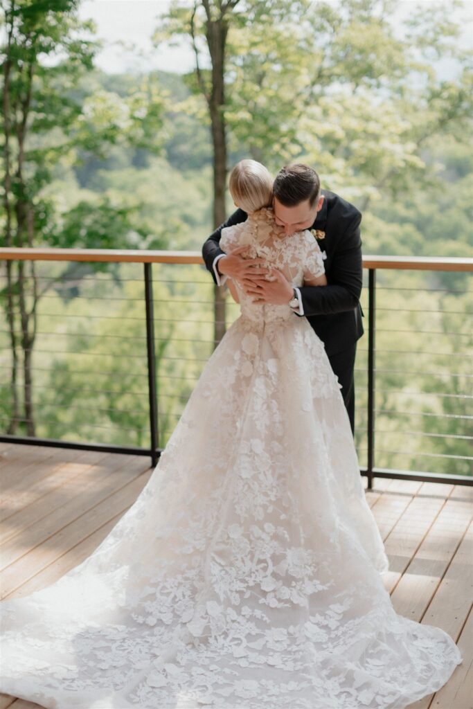 Bride and Groom share an embrace on outside patio deck.