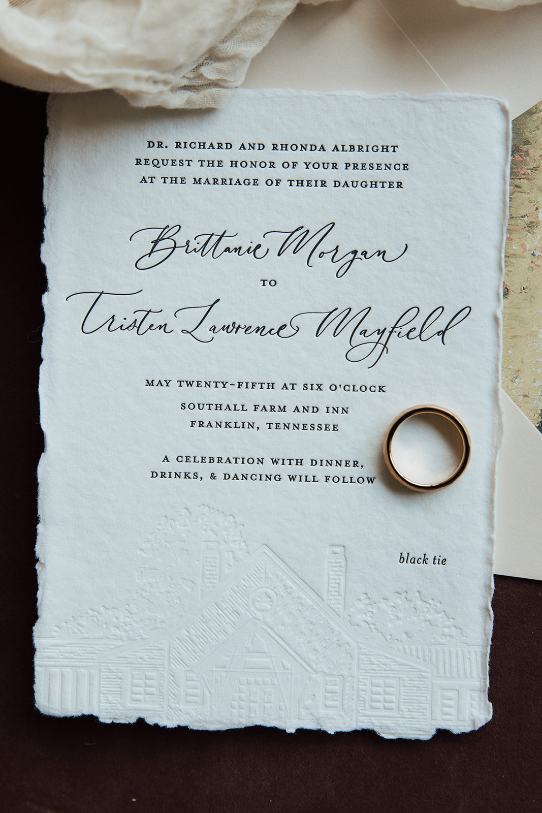 Styled flat-lay of custom wedding invitation with Textured paper