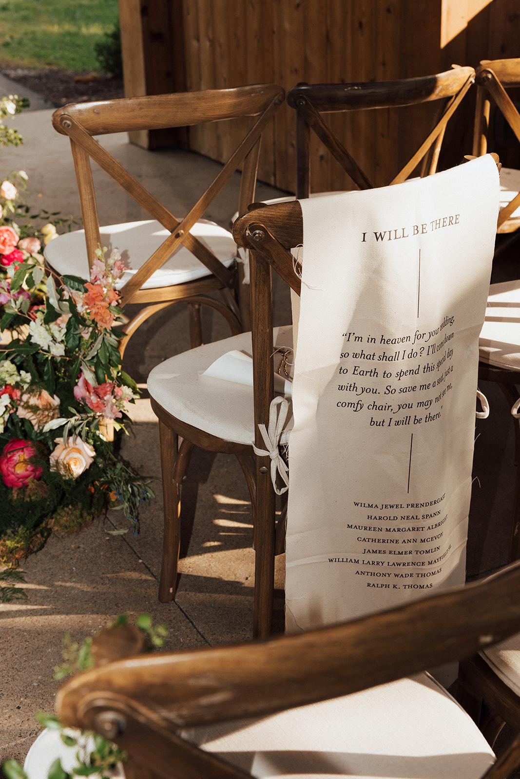 Fabric liner fastened to the back of ceremony chair in memory of those who have passed on.