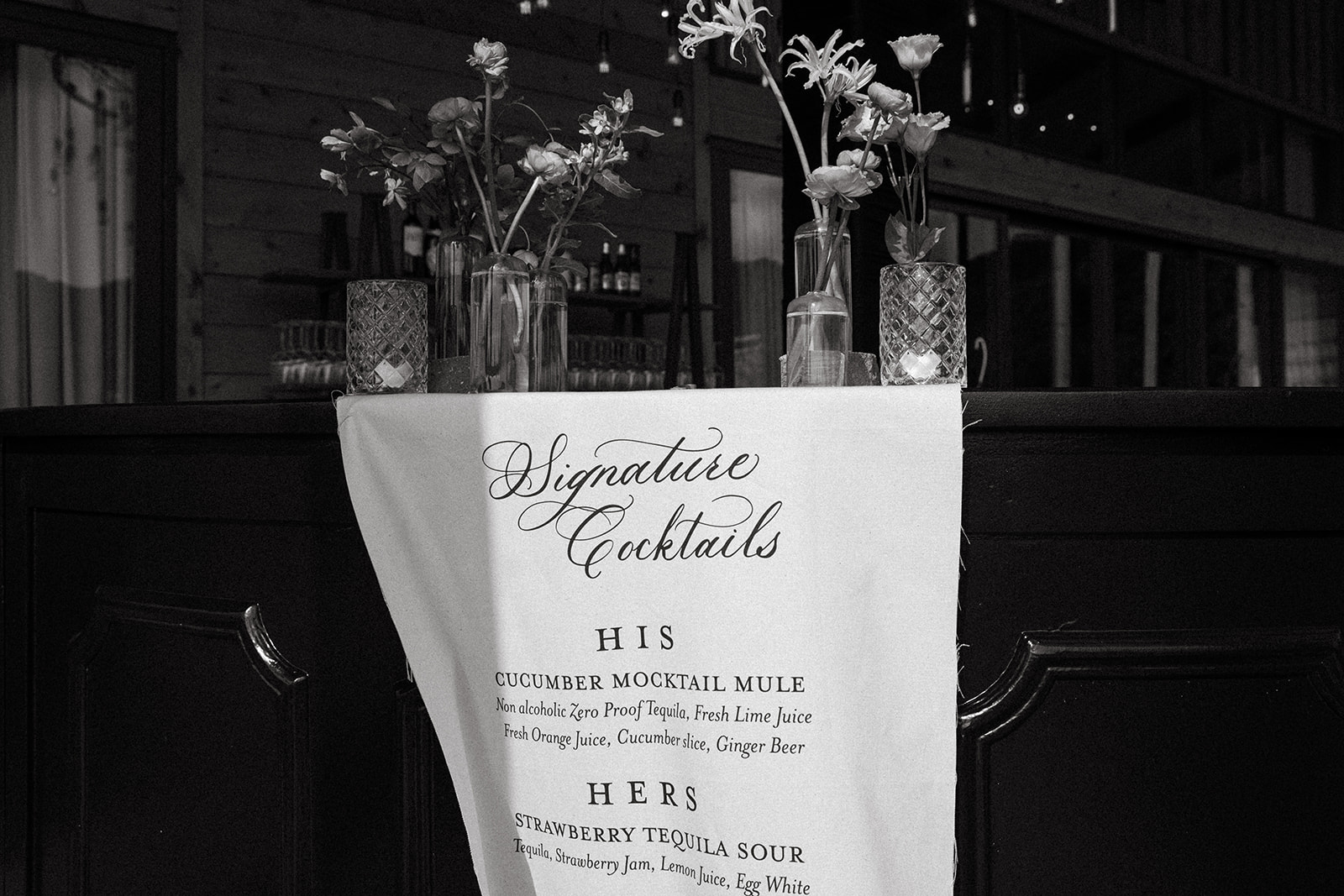 Fabric banner bar signage displaying signature cocktail menu. Textured Wedding Details