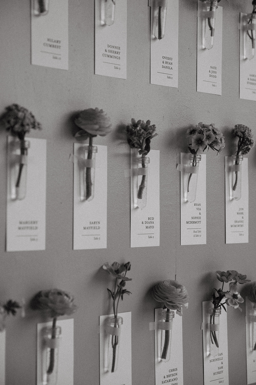 Seating chart display to include individual escort cards and flowers.