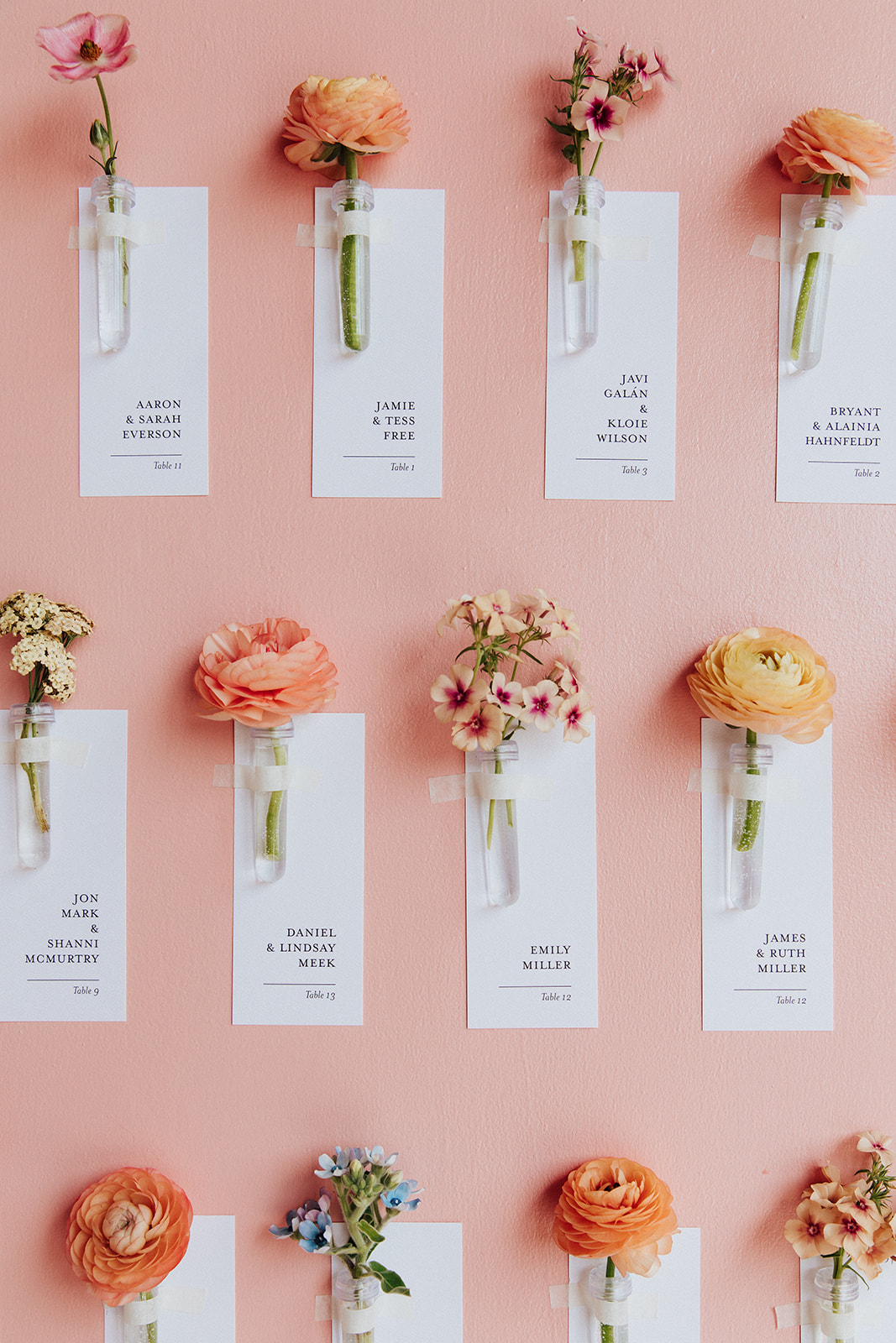 Seating chart display to include individual escort cards and flowers.