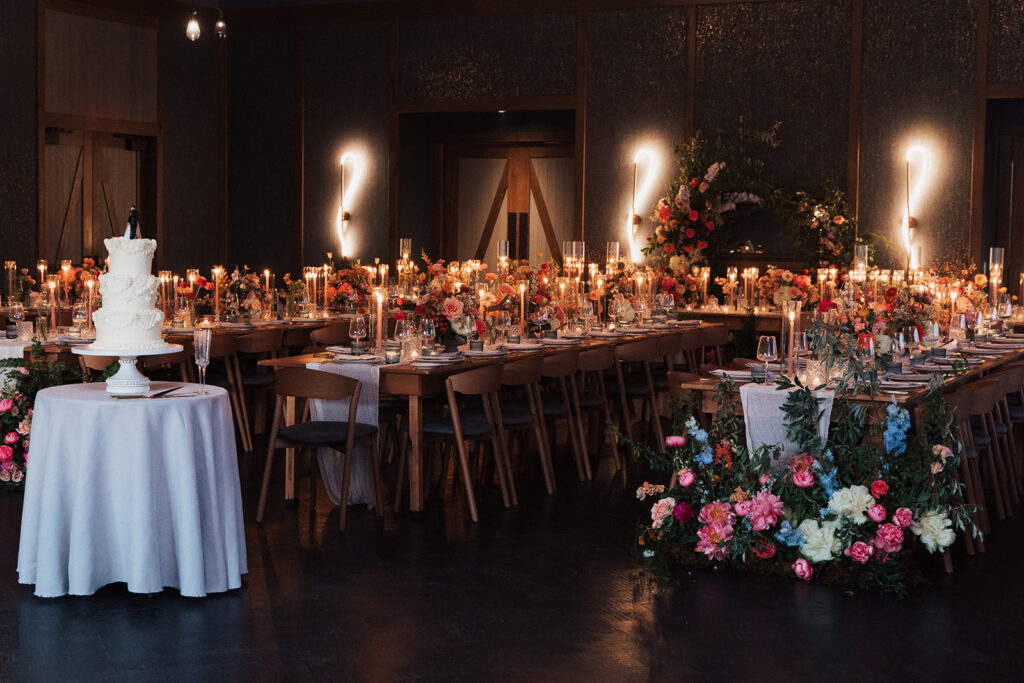 Reception venue area to include formal tables and settings, lighting, and florals. 