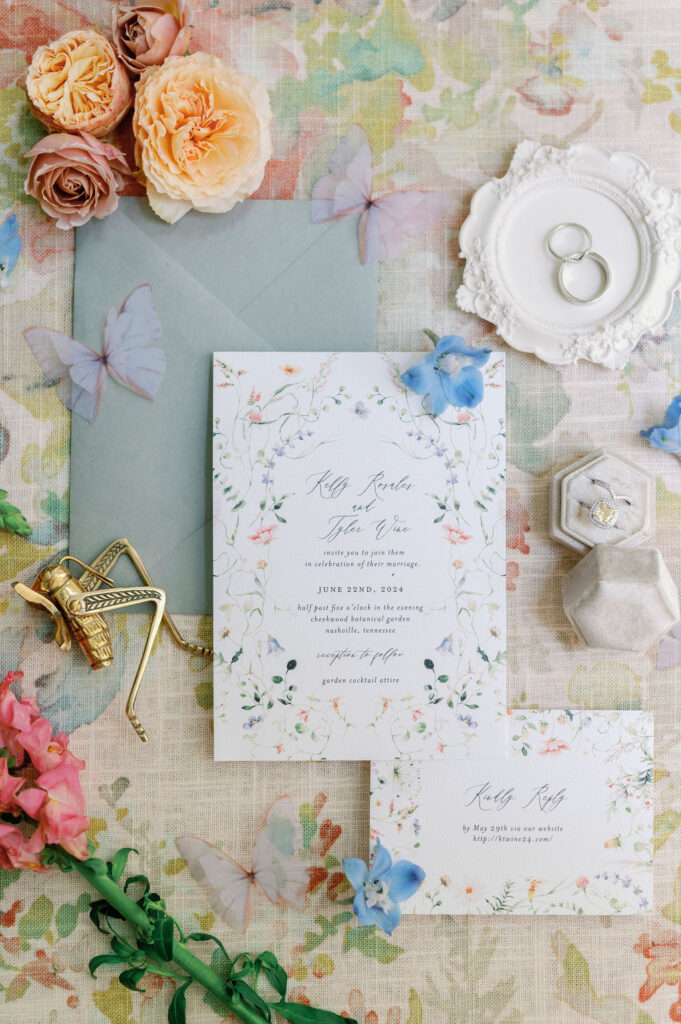 Flat lay of 2-piece wedding invitation suite