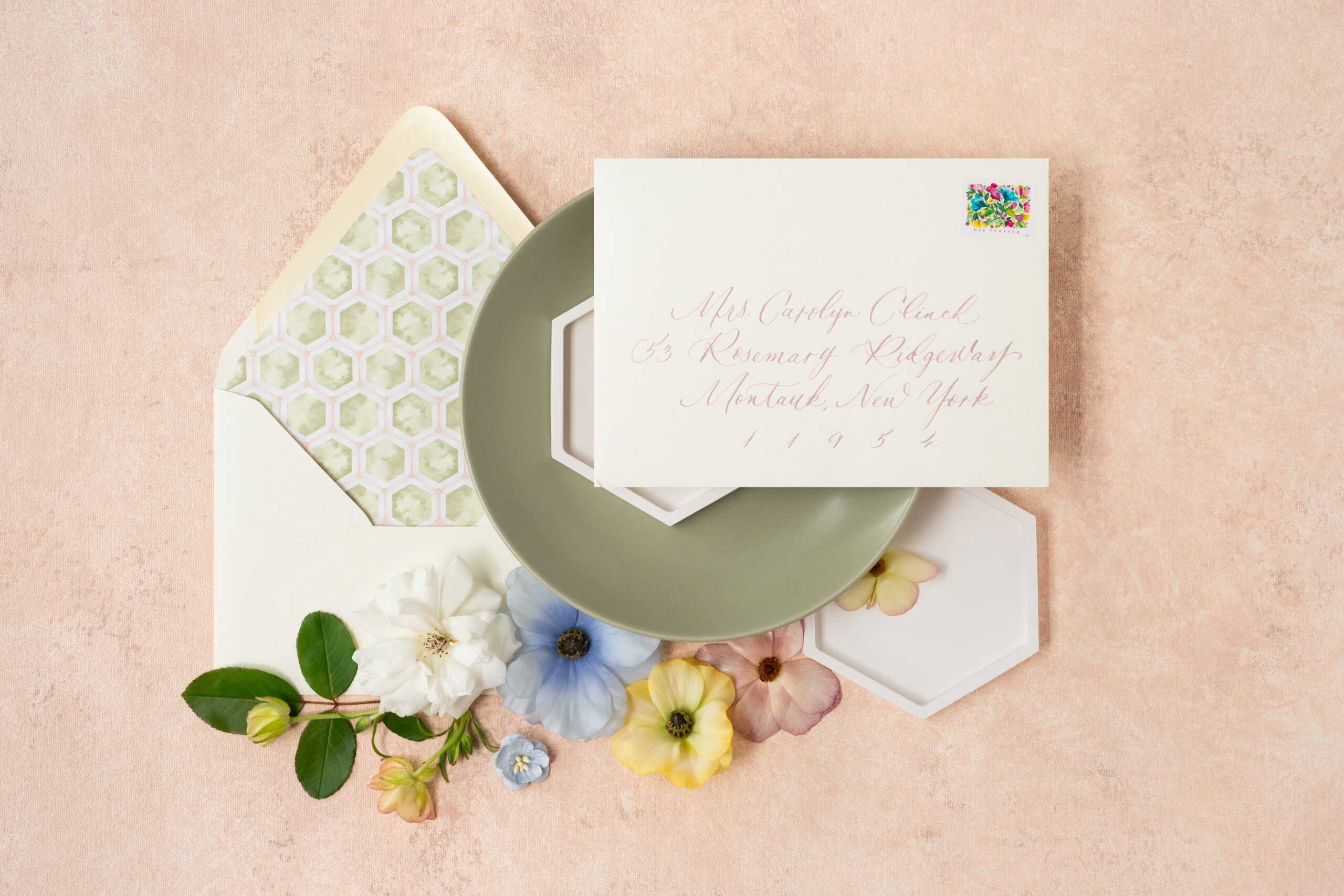 custom invitation envelope liner, and envelope calligraphy. styled with florals.