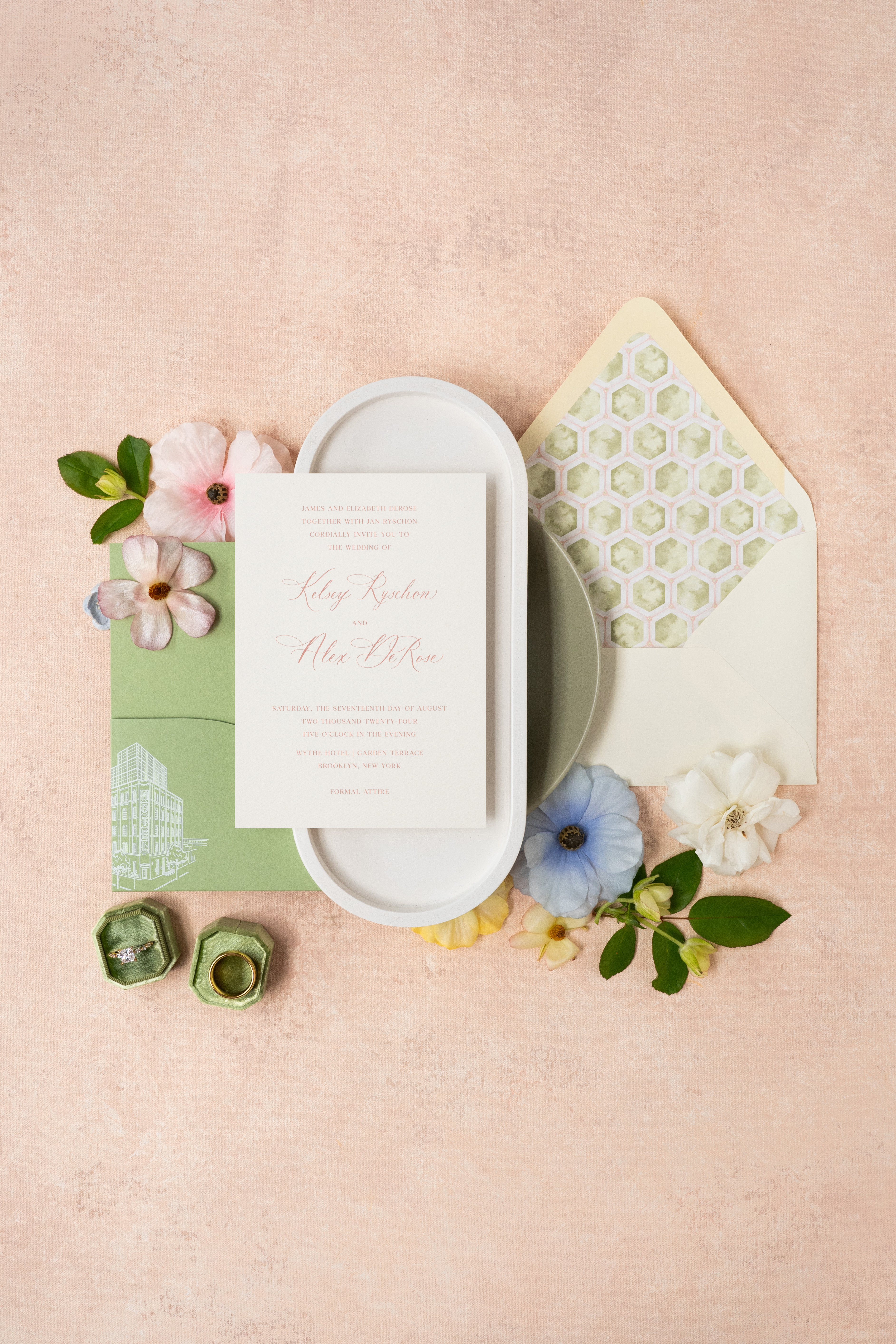 Custom wedding invitation suite showcasing custom die-cut pocket, custom architectural sketch, summer pinks, greens, envelope calligraphy, and custom envelope liner.