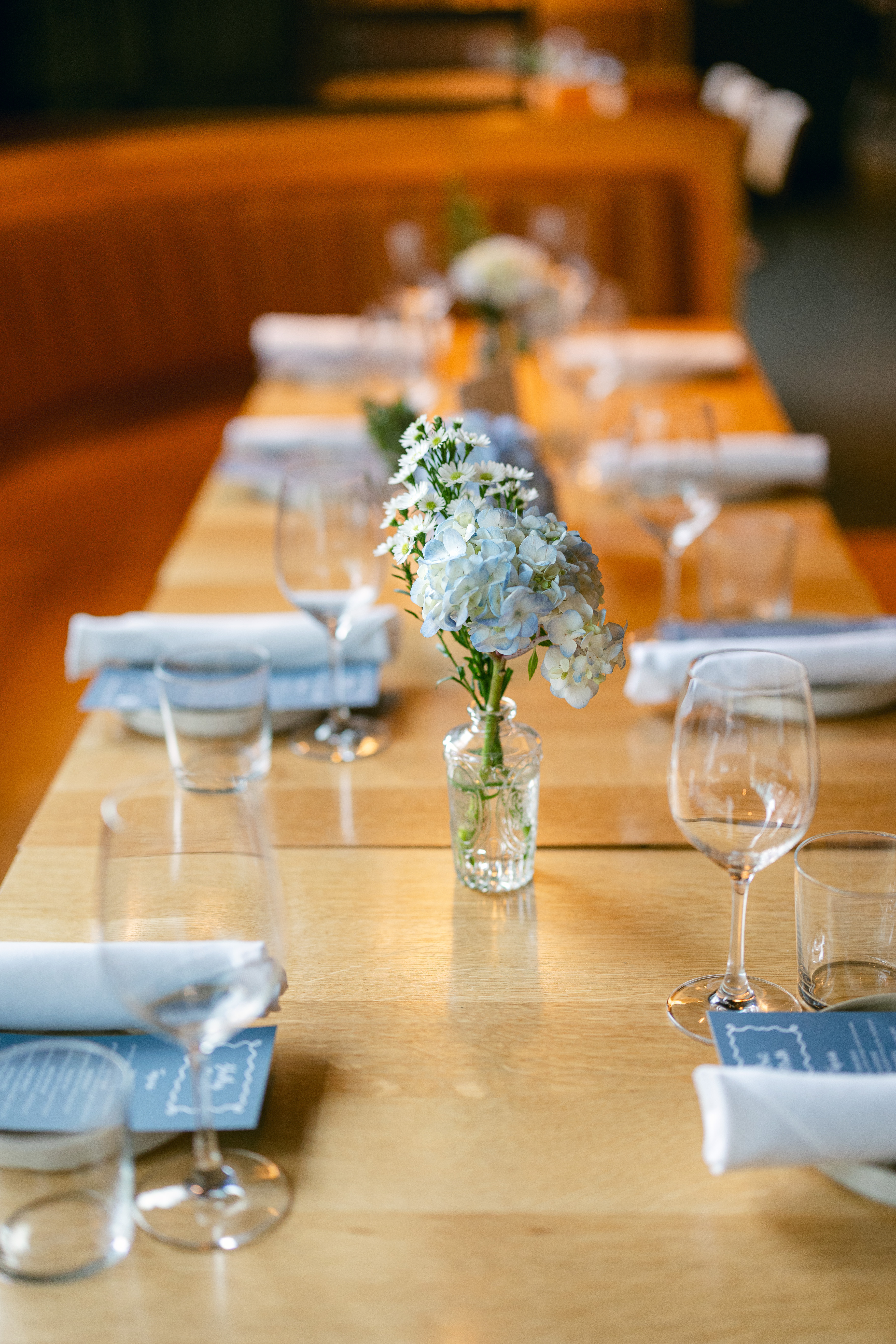 restaurant table set for rehearsal dinner.