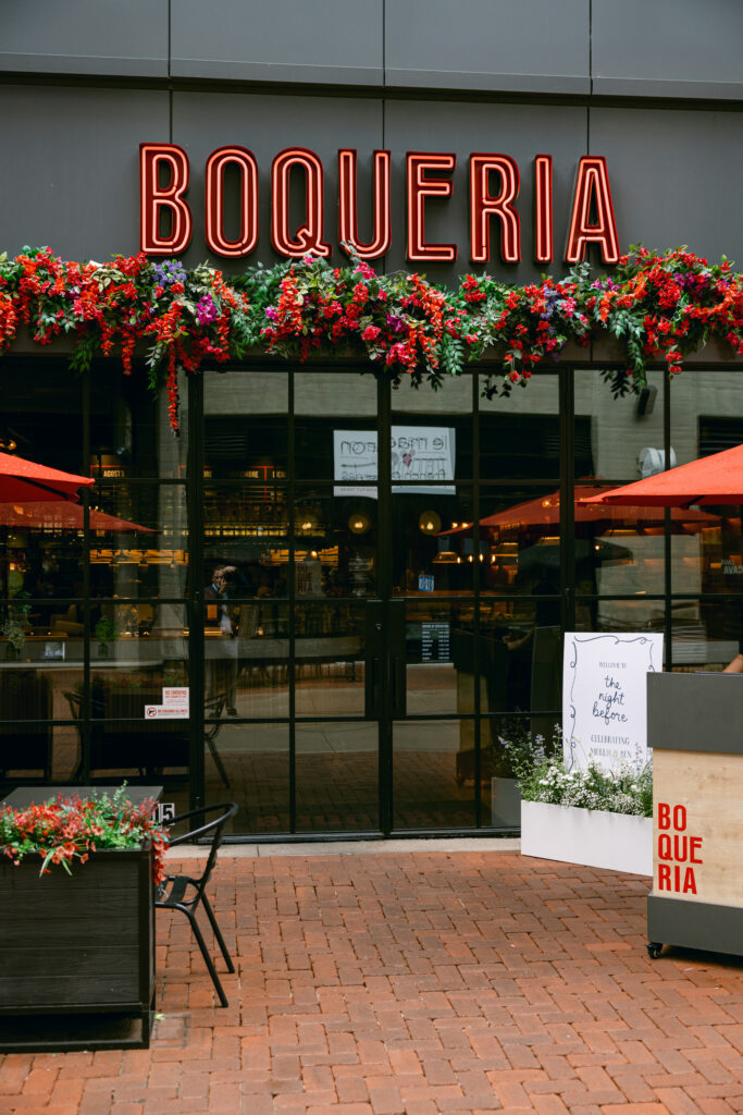 Boqueria Restaurant sign above outdoor entrance.