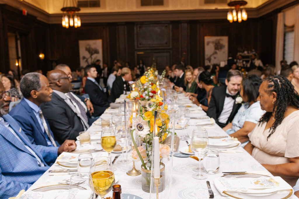 guests seated together at formal rection table.