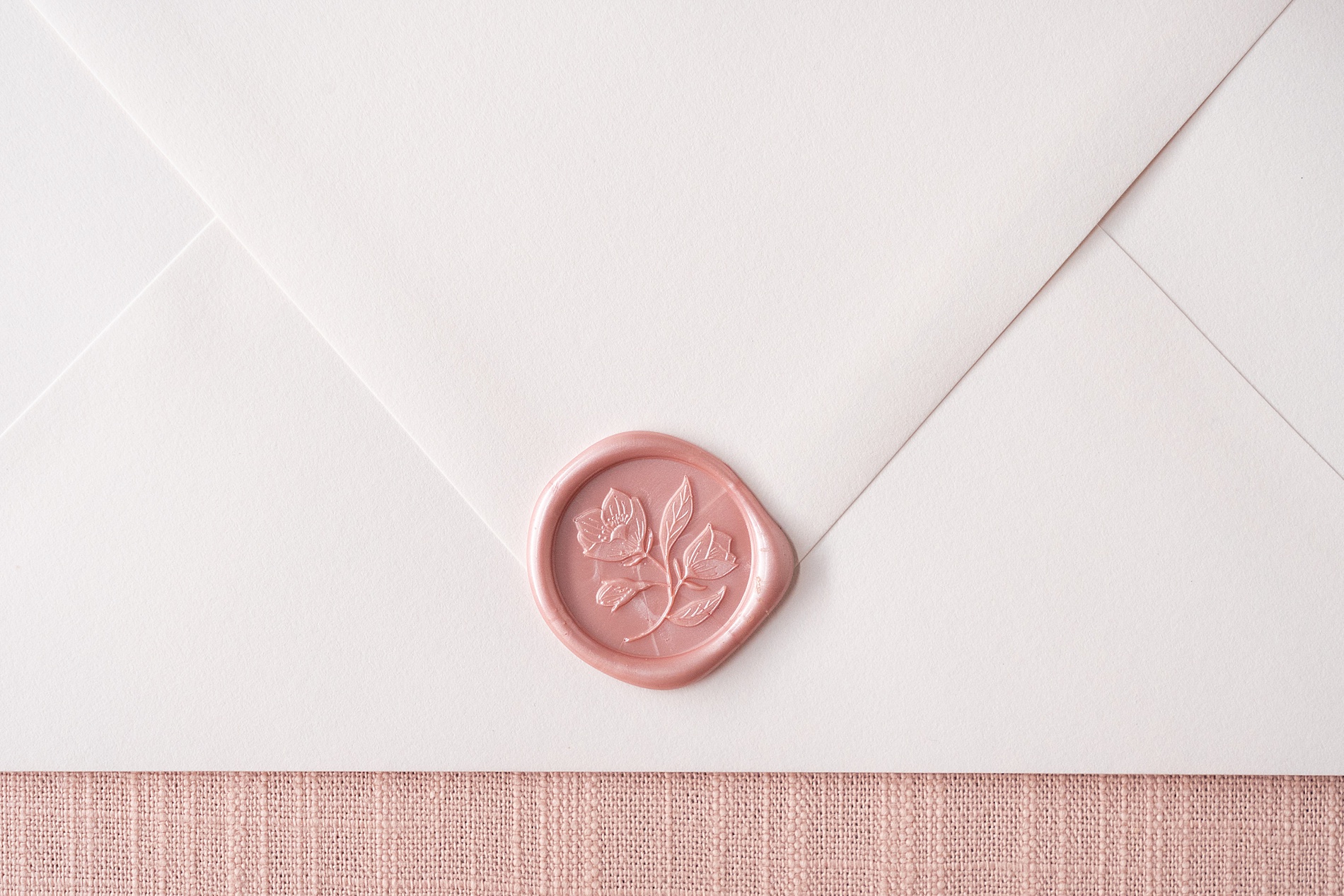 pearlized pink wax seal on envelope 