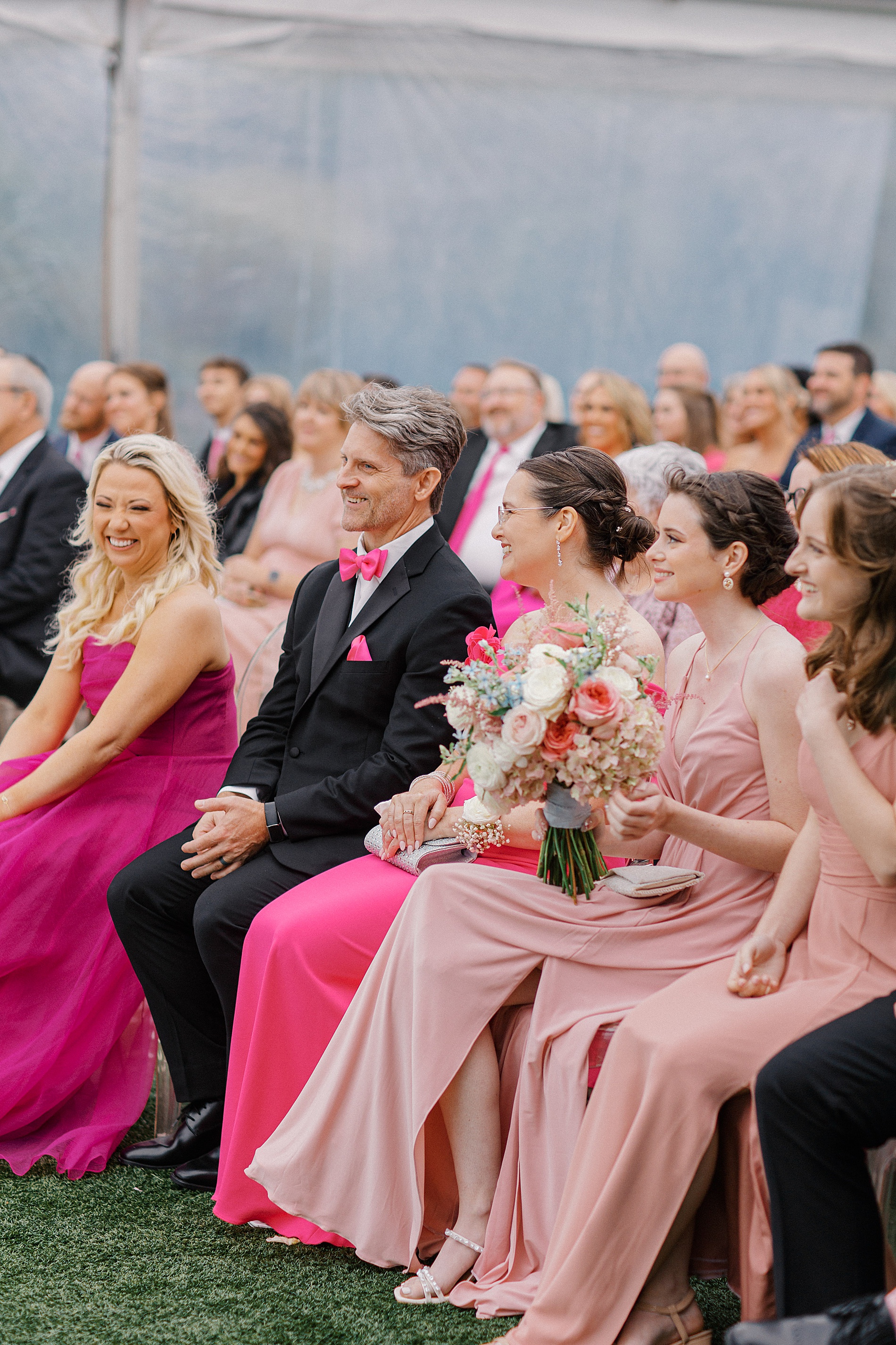 wedding guests in pink attire from Elevated Pink-Inspired Wedding in Nashville at Diamond Creek Farms