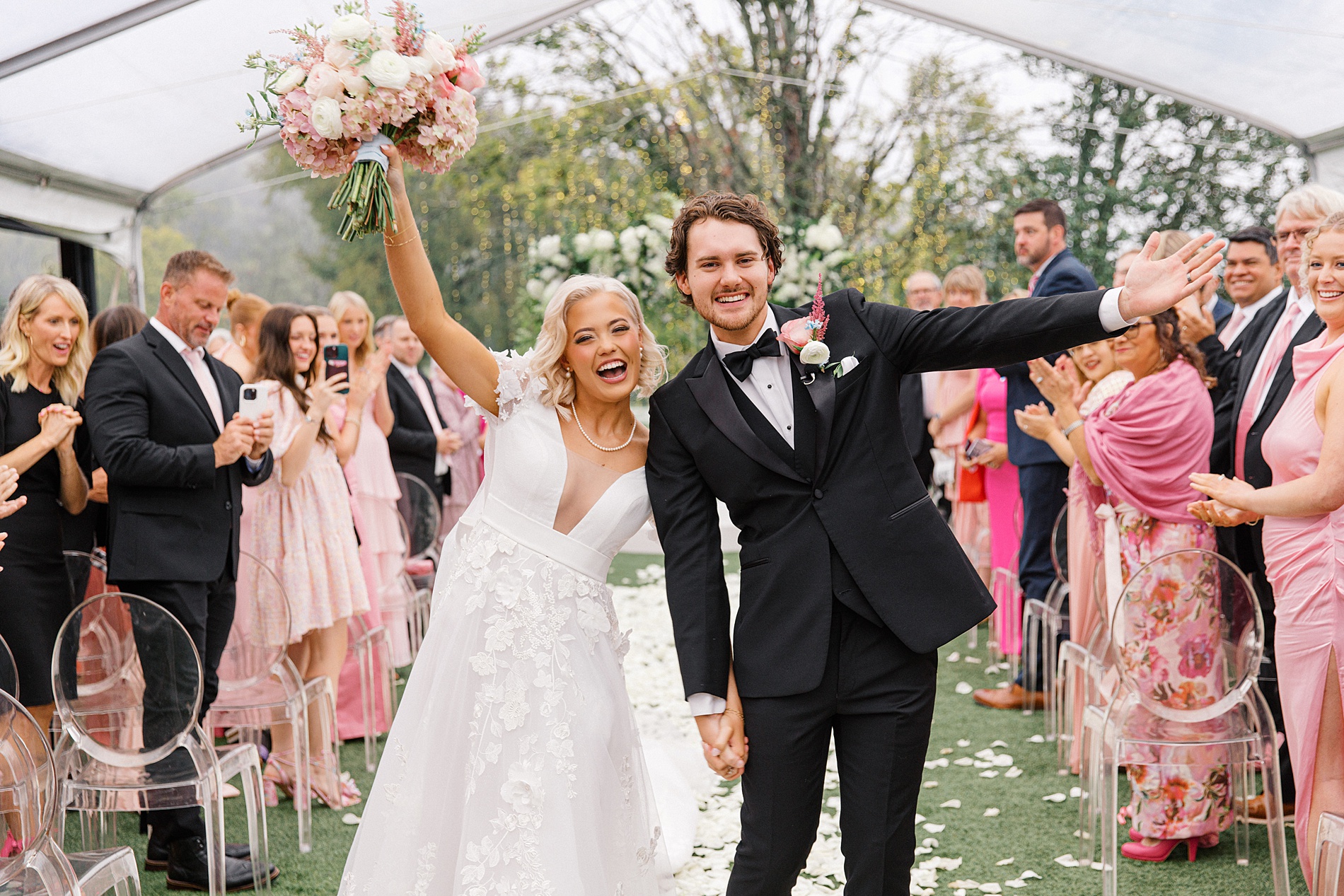 newlyweds exit wedding ceremony at Elevated Pink-Inspired Wedding in Nashville  