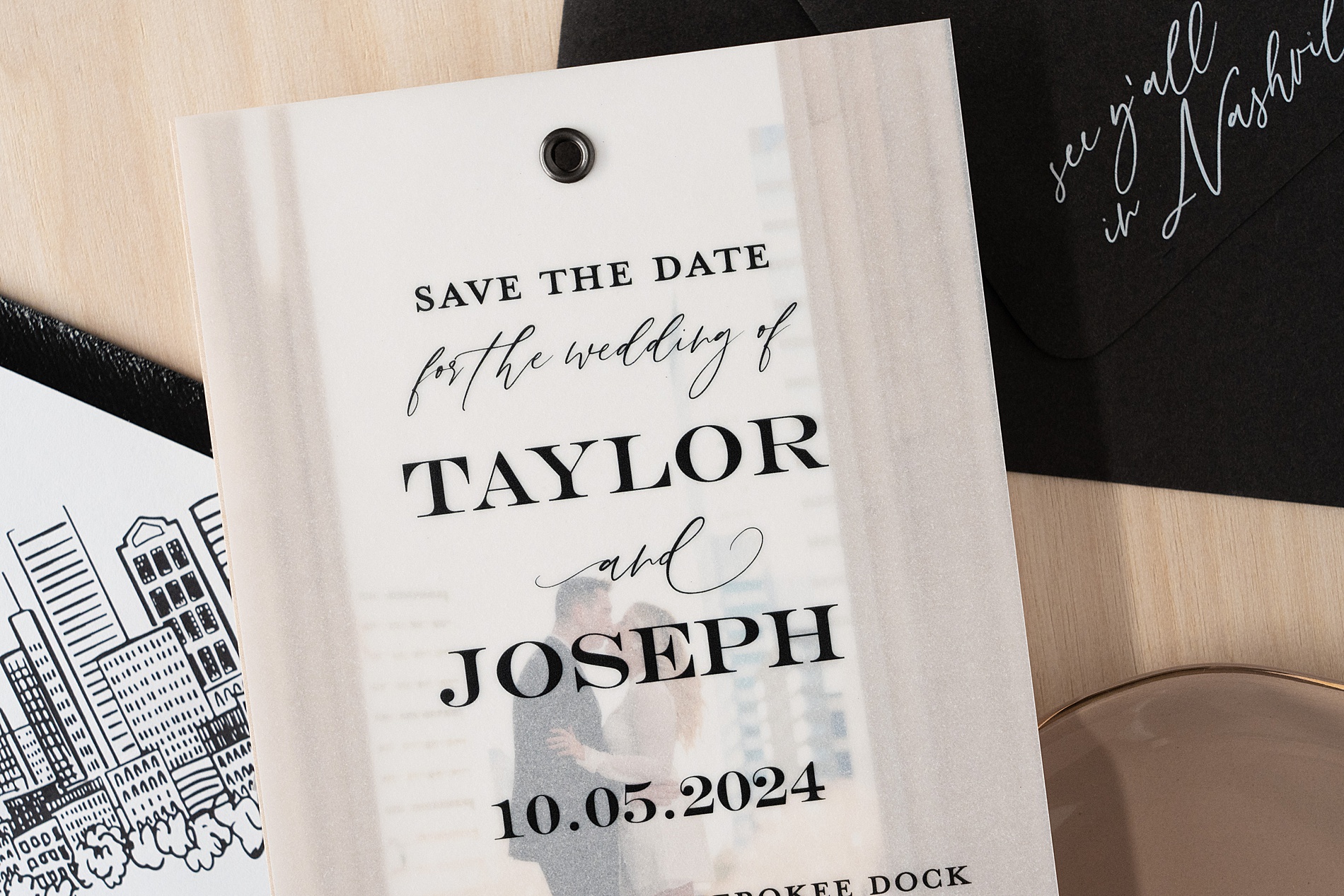 vellum overlay save the date with wedding details printed on it on top of engagement photo