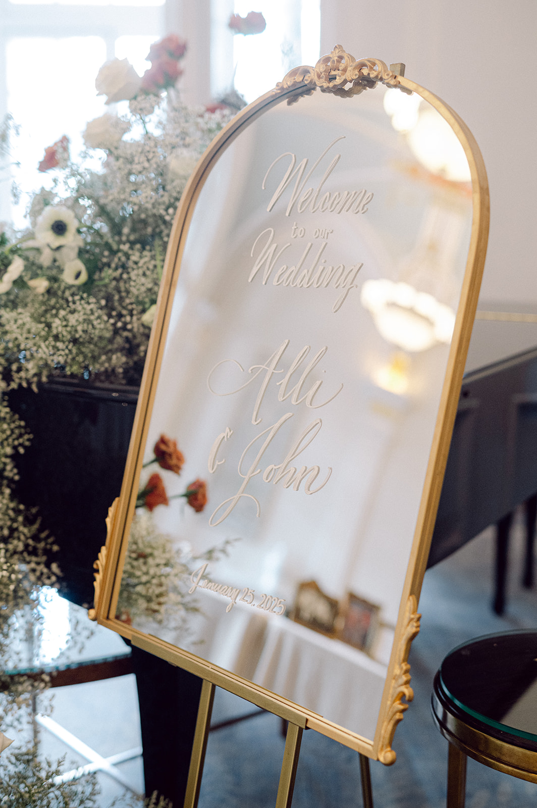 vintage mirror with gold frame used as Welcome sign for elegant Nashville wedding 