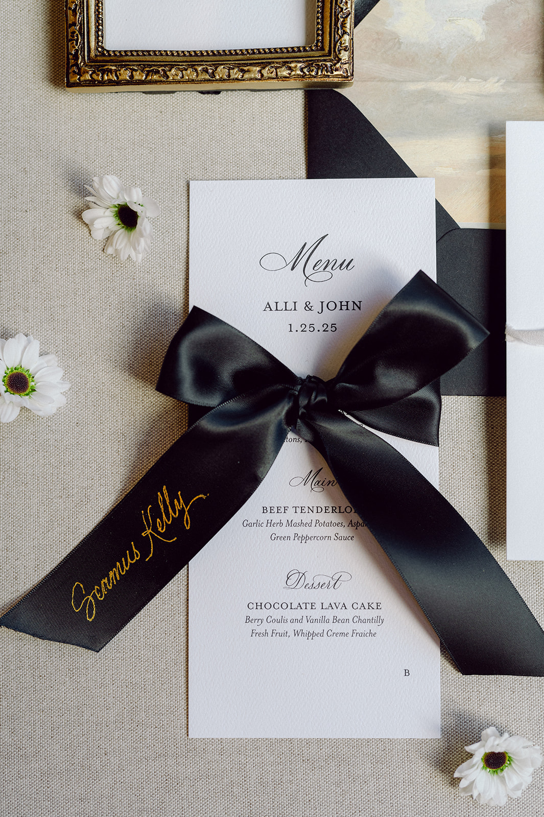 black ribbon place cards with hand lettered hot foiled calligraphy 